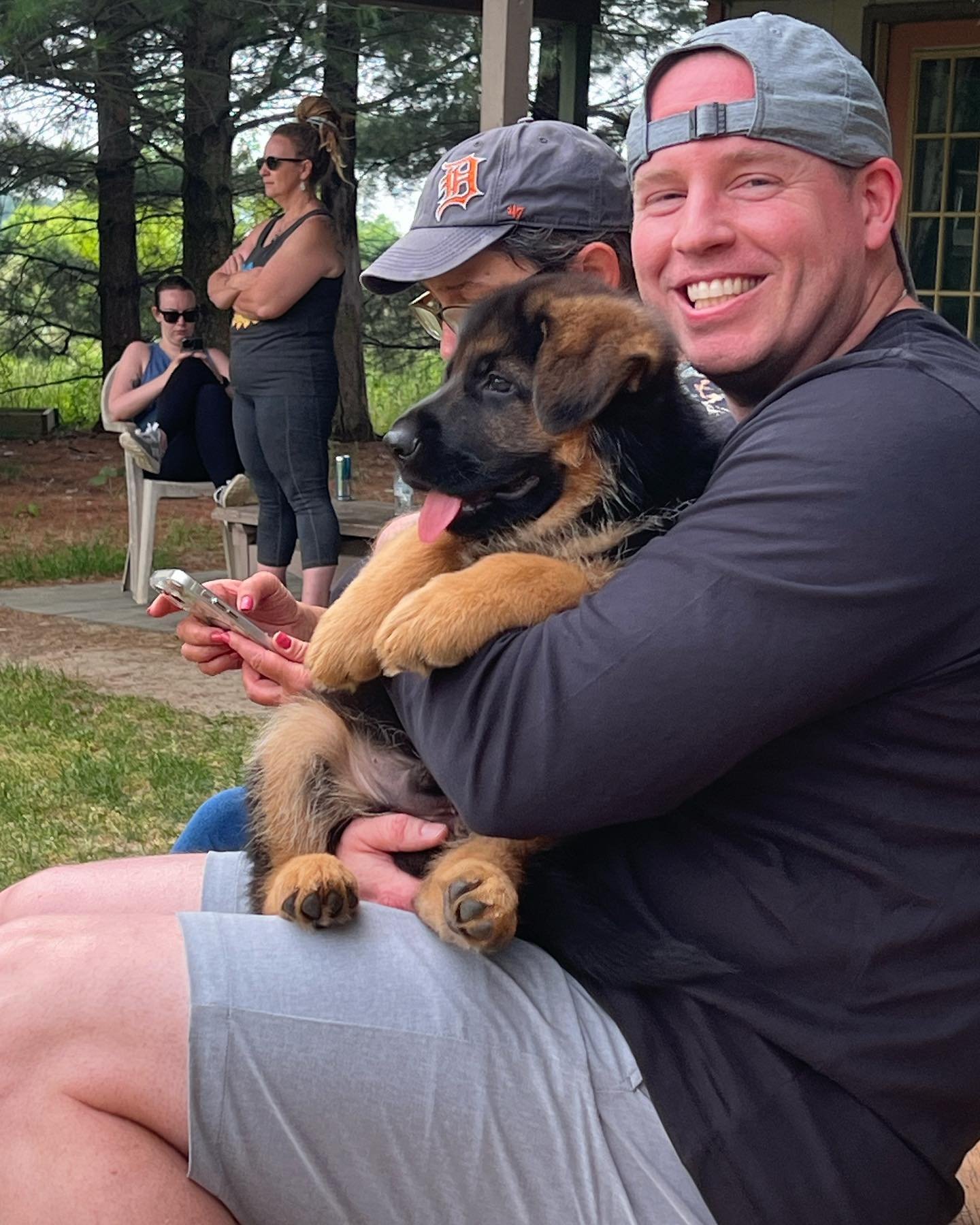 Happy family with their new German Shepherd puppy